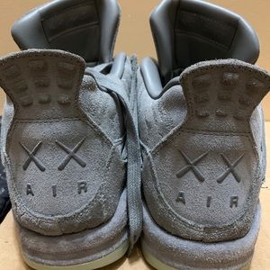 Grey Kaws Jordan 4s